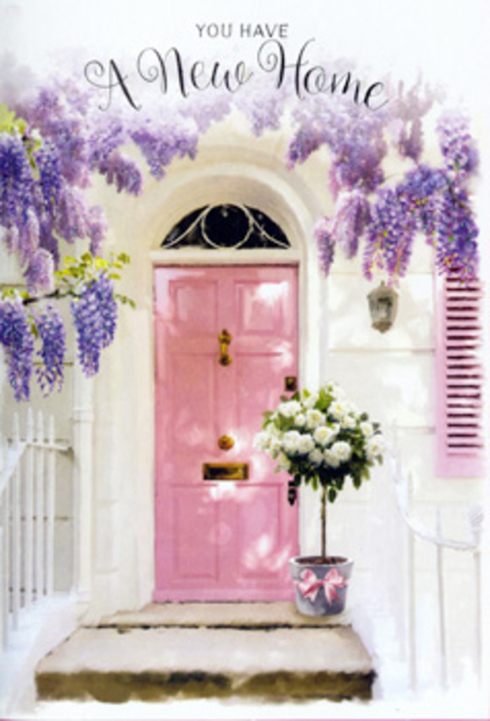This serene doorway in Malden Rushett captures the comforting blend of countryside charm and fresh possibility, with a painted pink front door that radiates gentle warmth against chalky white walls. Overhead, dense strands of wisteria in soft lavender and dusky purple sway lazily, their flower clusters hanging like scented tassels that you can almost brush with your fingertips as you step inside. The blooms frame the entrance like a living garland, catching stray rays of light that could have drifted in from the open spaces beyond Rushett Lane. The door itself is flanked by a softly painted shutter in a matching pastel hue, unifying the façade with quiet, cheerful cohesion. At the base of the door, a stylish tin bucket rests on the step, filled to overflowing with creamy white and ivory roses. Each rose is at its velvety best, petals curled outward in generous spirals, accented by airy sprigs of fresh green foliage that give the arrangement movement and texture. A delicate satin ribbon in blush pink wraps the bucket, its soft bow sitting neatly at the front, echoing the romance of a lovingly chosen housewarming gift. Light falls in a gentle wash across the stone step, creating subtle shadows and highlighting the roses' creamy depths. There is a sense of pause in the moment, as if someone has just stepped inside to set down their keys after the first day in their new home near the Malden Rushett crossroads. The whole composition feels like a promise: of neighbours to meet, evenings on the doorstep, and memories yet to be made, all heralded by the quiet, welcoming beauty of flowers arranged with local care.