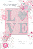 The image shows a romantic anniversary card that blends pastel artistry with a sense of treasured intimacy, reminiscent of a quiet evening walk through the calm streets of Malden Rushett. At the centre, the word LOVE is spelled out in soft, raised glitter letters, each one a blend of blush pink and shimmering pearly tones. The letter O is subtly suggested as a heart-like curve within the design, edged with a touch of silver that catches the light, giving the impression of a tiny jewel set into paper. The background is a gentle blush pink, smooth and velvety to the eye, creating a warm canvas for the artistry above. Surrounding the word, a constellation of delicate blooms, buds, and swirling vines unfolds in tones of blush, soft mauve, and silvery grey. Their lines are fine and flowing, like watercolour sketches a florist might make when planning an anniversary bouquet on the bench behind the shop. Some petals are shaded with the lightest touch, while others are accented with silver highlights that glimmer like morning mist on petals in a country garden. Small flourishes-tiny petals, stray curls, and faint butterfly shapes-add a sense of motion and playfulness without overwhelming the calm composition. Elegant script phrases, including sentiments such as On Our Anniversary and I love you today and always, are placed thoughtfully within the design, balancing the floral elements with meaningful words. Overall, the card radiates a soft, heartfelt atmosphere, perfectly suited to marking a shared journey of love in Malden Rushett and beyond.